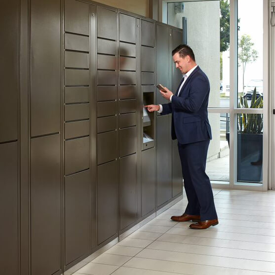 man picking up package